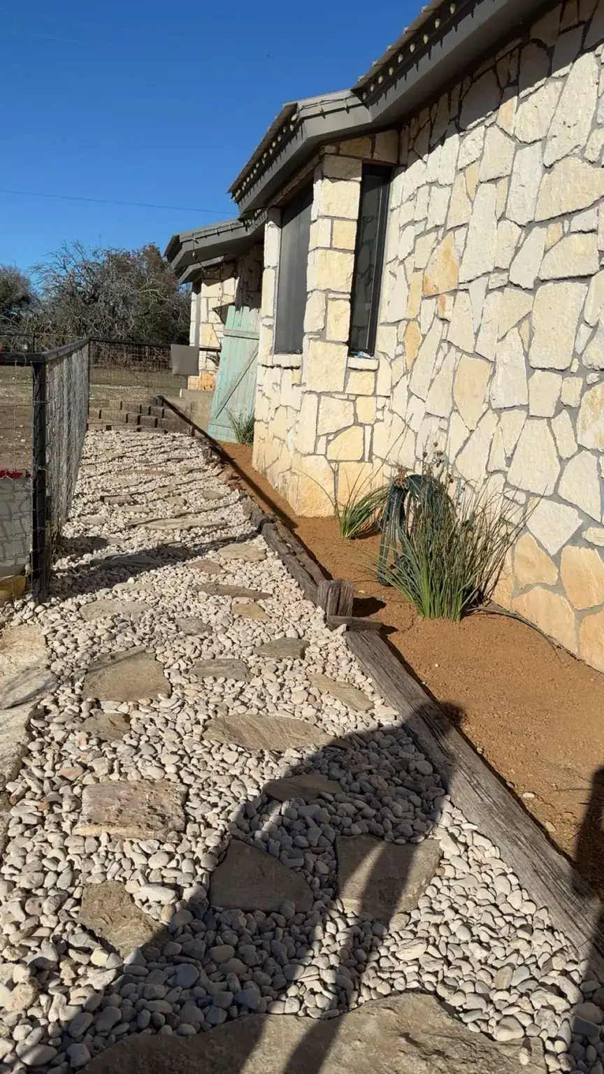 Walkway and flower bed after - fresh rock and clean edging