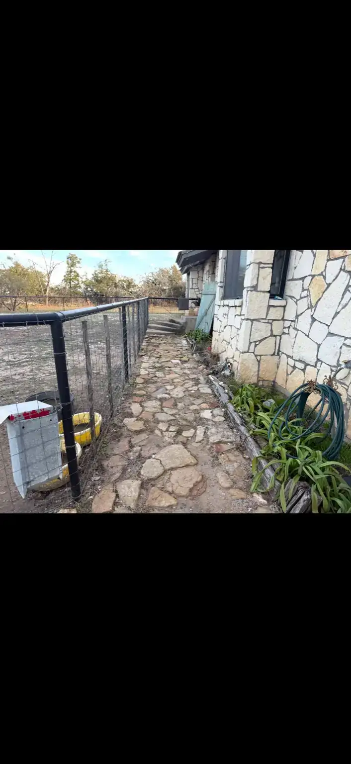 Walkway and flower bed before